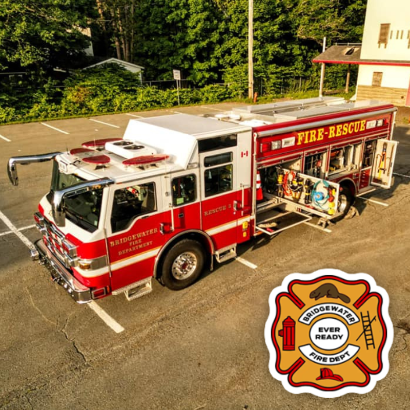A fire truck sits in a parking lot with all doors open, and the Bridgewater Fire Department logo is to the bottom right
